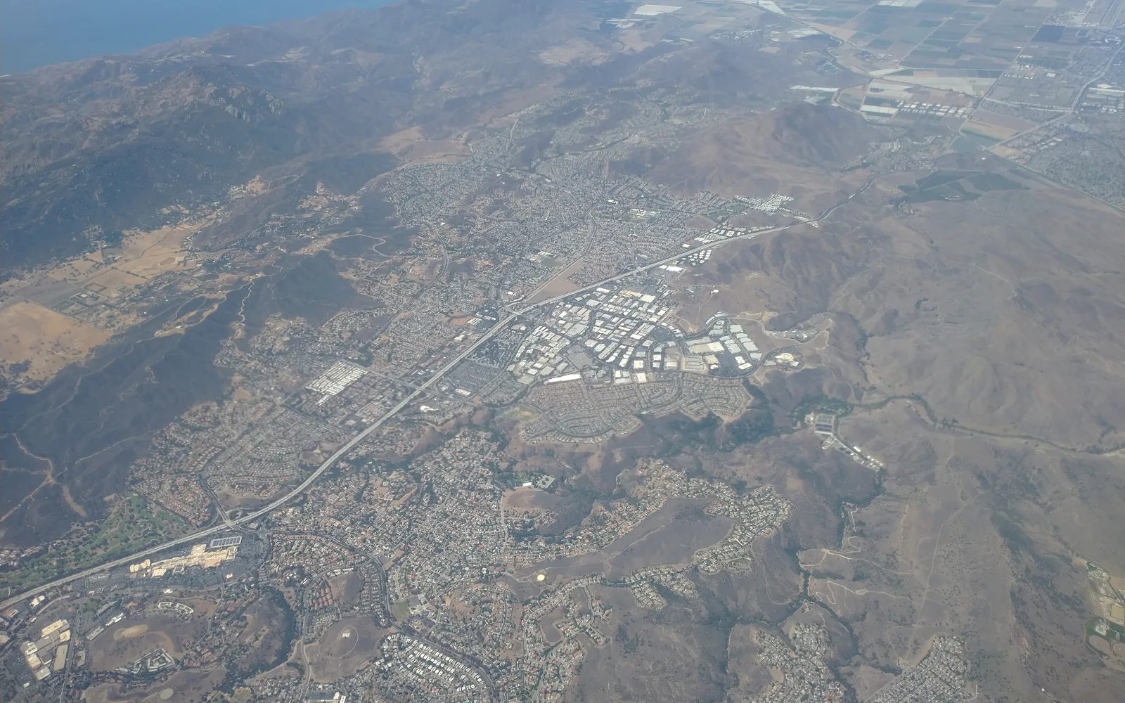 An aerial view of suburban neighborhoods with commercial and residential buildings in Newbury Park, Thousand Oaks